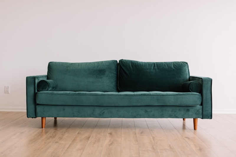 Cream sofa with layered cushions in a warm interior